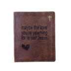 A brown faux-leather Bible cover or journal with a gold cross in the top right corner and the printed phrase 'maybe the love you're yearning for is just Jesus' with a heart and underline graphic on the front, shown on a plain white background.