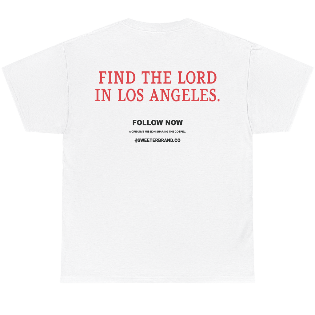 White short-sleeve t-shirt shown from the back, featuring the text 'FIND THE LORD IN LOS ANGELES.' in red, with 'FOLLOW NOW' and '@SWEETERSBRAND.