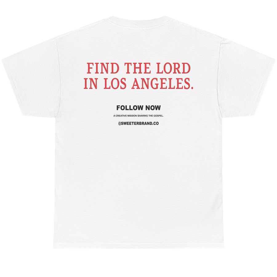 White short-sleeve t-shirt shown from the back, featuring the text 'FIND THE LORD IN LOS ANGELES.' in red, with 'FOLLOW NOW' and '@SWEETERSBRAND.