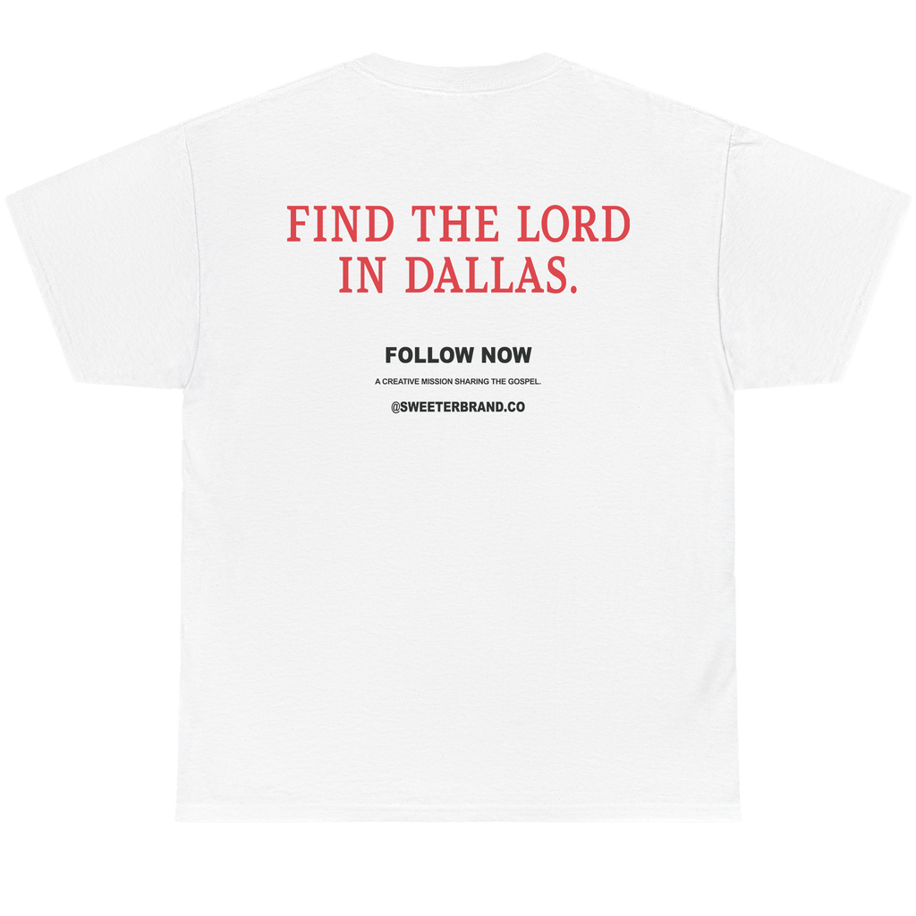 White short-sleeve t-shirt shown from the back, featuring red text that reads 'FIND THE LORD IN DALLAS.' and smaller black text below reading 'FOLLOW NOW' with '@SWEETERSBRAND.