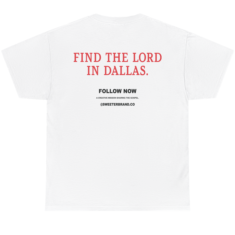 White short-sleeve t-shirt shown from the back, featuring red text that reads 'FIND THE LORD IN DALLAS.' and smaller black text below reading 'FOLLOW NOW' with '@SWEETERSBRAND.