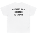White short-sleeve t-shirt shown from the back, featuring the text 'CREATED BY A CREATOR TO CREATE' printed in bold black capital letters across the upper back.