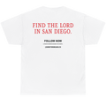White short-sleeve t-shirt shown from the back, featuring red and black printed text on the center back that reads 'FIND THE LORD IN SAN DIEGO.' with smaller 'FOLLOW NOW' text below.
