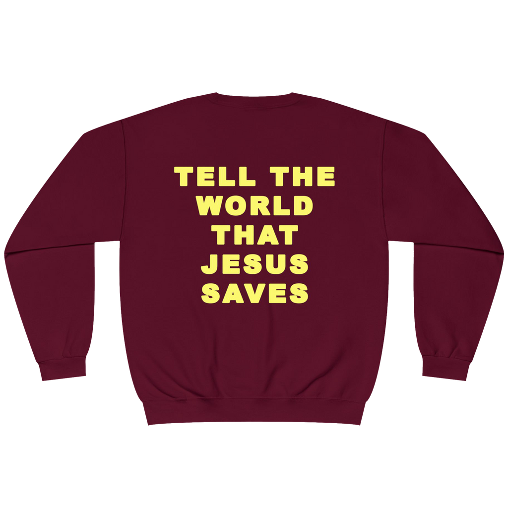 A maroon crewneck sweatshirt with the phrase 'TELL THE WORLD THAT JESUS SAVES' printed in bold yellow capital letters on the back, shown against a plain white background.