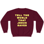 A maroon crewneck sweatshirt with the phrase 'TELL THE WORLD THAT JESUS SAVES' printed in bold yellow capital letters on the back, shown against a plain white background.
