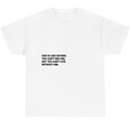 A white short-sleeve crewneck t-shirt with a black printed text quote on the chest, displayed against a solid white background.