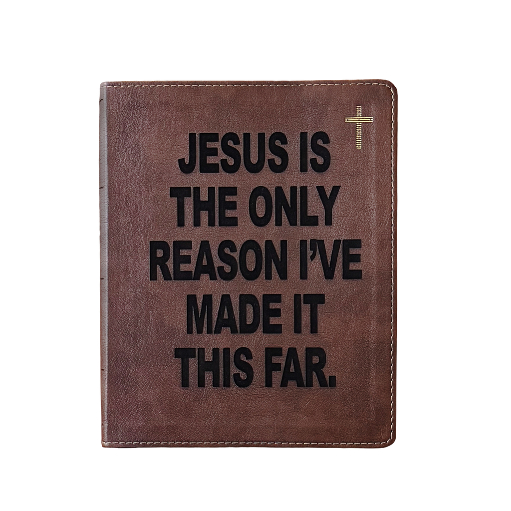 A brown leather Bible-style book cover with black text reading 'JESUS IS THE ONLY REASON I'VE MADE IT THIS FAR.' and a small gold cross in the top right corner, shown on a plain white background.