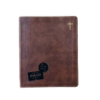 A brown faux-leather Bible cover with white contrast stitching, a small gold cross on the top right, and two black promotional stickers on the bottom left, shown against a plain white background.