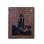 A brown leather-bound book or journal featuring a black silhouette graphic of a shepherd holding a staff, with a small gold cross in the upper right corner, shown on a plain white background.