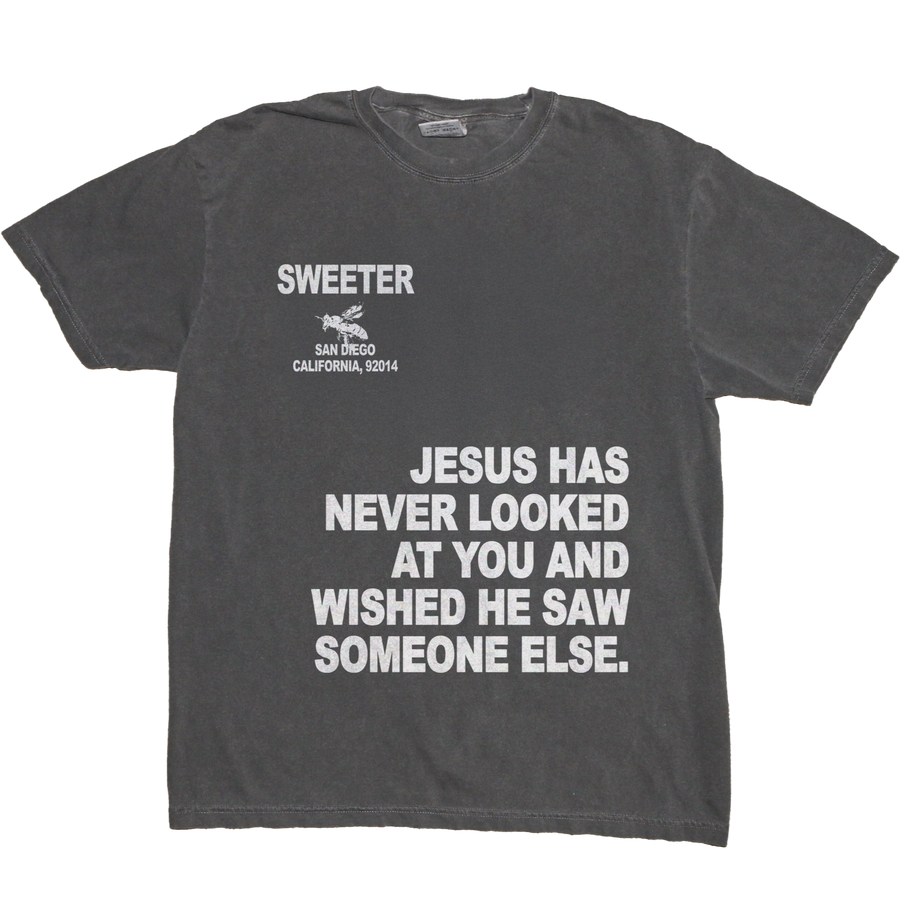 A dark gray graphic t-shirt with white printed text and a small bee logo on the chest, displayed flat against a white background.