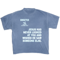 A faded blue crewneck t-shirt with white printed text on the front. The text reads 'SWEETER SAN DIEGO CALIFORNIA, 2014' above a silhouette of a cowboy riding a horse, and 'JESUS HAS NEVER LOOKED AT YOU AND WISHED HE SAW SOMEONE ELSE.